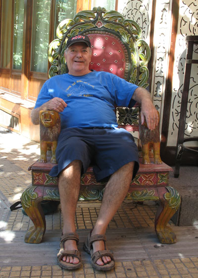 Francis Caruso relaxes on an oriental throne