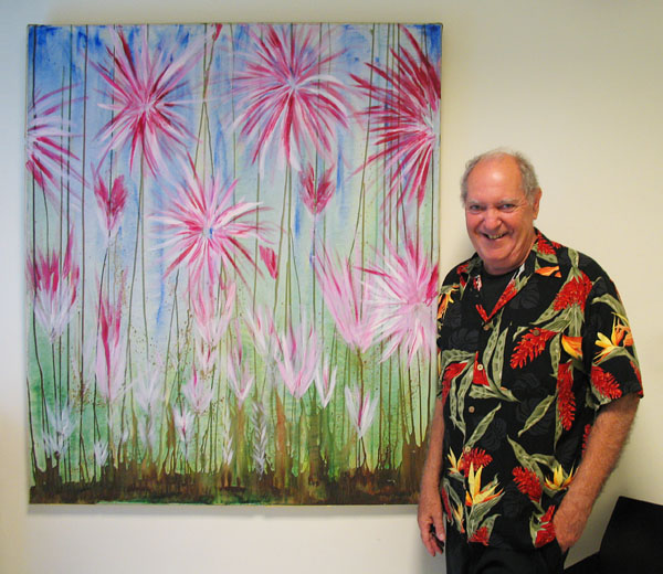Francis Caruso with one of his paintings in a client's office in Athens, Greece