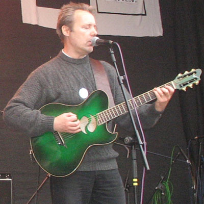 Hugh Featherstone on guitar at Weltfest on Boxhagener Platz, Berlin, 2006