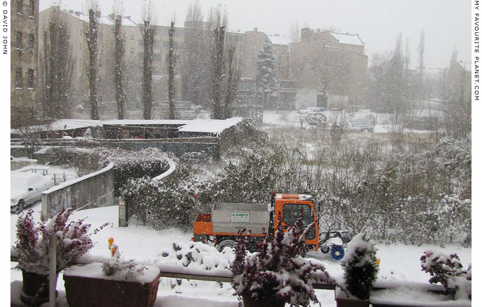 A snowplough in action on a Berlin street by David John at The Cheshire Cat Blog