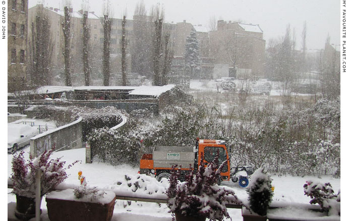 A snowplough in action on a Berlin street by David John at The Cheshire Cat Blog A snowplough in action on a Berlin street by David John at The Cheshire Cat Blog