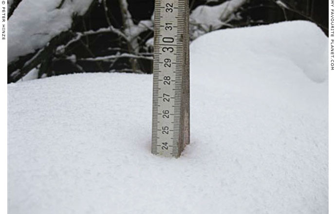 Measuring the depth of snow in Bernau by Peter Hinze at The Cheshire Cat Blog