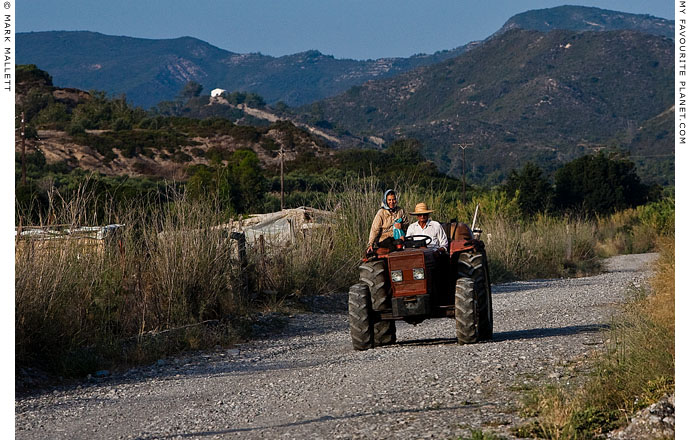 Farmers on a tractor in Rhodes, Greece by Mark Mallett at The Cheshire Cat Blog