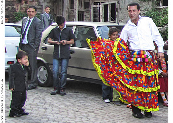 Young boy in Istanbul astonished to see a male kocheck dancer in a skirt at The Cheshire Cat Blog