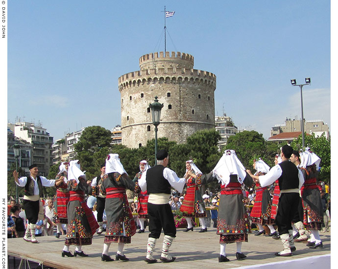 Macedonian dancers perform a traditional dance in front of Thessaloniki's White Tower, at The Cheshire Cat Blog