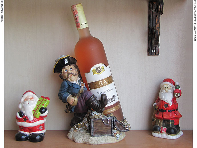 A pirate carrying a bottle of Turkish wine in a restaurant in Ephesus, Turkey at The Cheshire Cat Blog