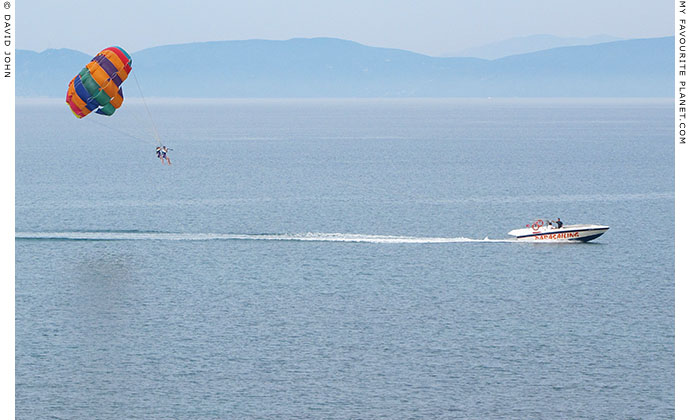 Couple parachute gliding off the coast of the Dilek Peninsula, Turkey at The Cheshire Cat Blog
