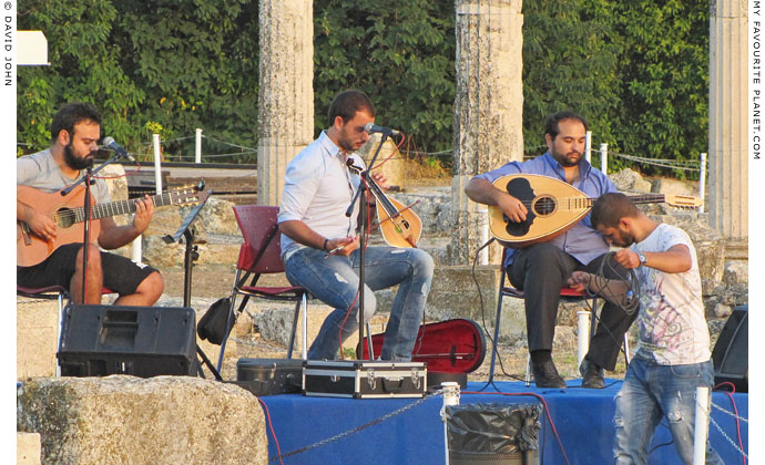 Cretan lyra player George Sfakianakis and his band at the archaeological site of Pella, Macedonia, Greece