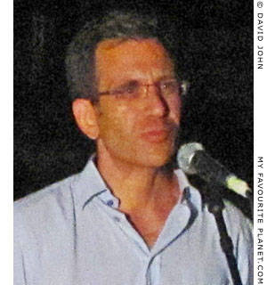 Museum director Haris Tsougaris welcomes the audience to the 2013 August full moon concert at Pella archaeological site, Macedonia, Greece