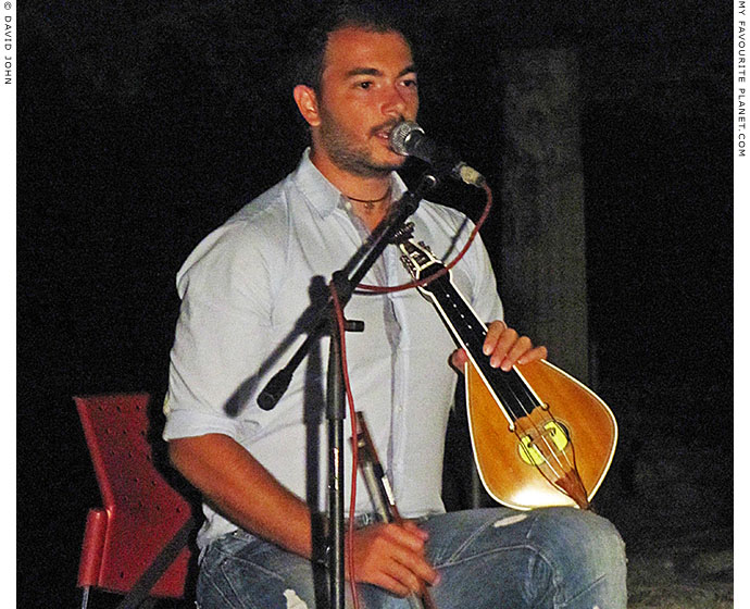 George Sfakianakis plays lyra and sings traditional Cretan songs in Pella, Greece at The Cheshire Cat Blog
