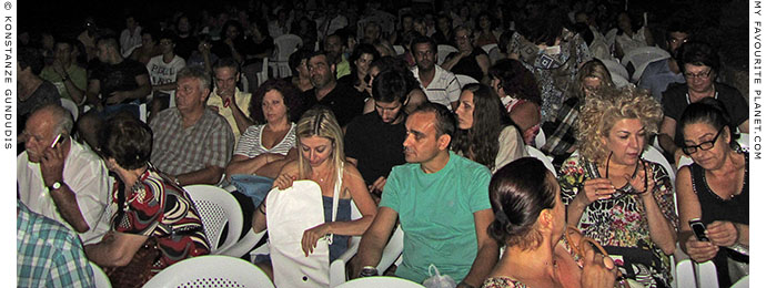 The audience at a concert of traditional Cretan music in Pella, Greece at The Cheshire Cat Blog