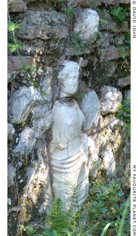 Statues built into a wall in Dion Archaeological Park at The Cheshire Cat Blog