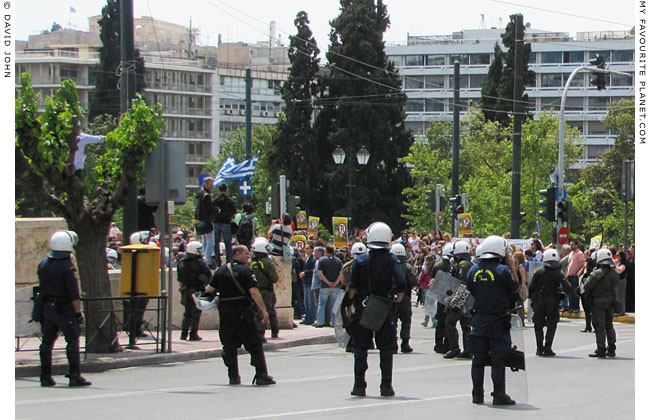 Greek riot police in Syntagma Square, Athens at the Mysterious Edwin Drood's Column