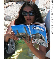 Tourist reading a guide book on the Acropolis, Athens at My Favourite Planet Tourist reading a guide book on the Acropolis, Athens at My Favourite Planet