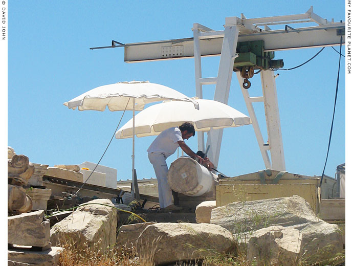 Restoration workers repair a column on the Acropolis, Athens, Greece at My Favourite Planet Restoration workers repair a column on the Acropolis, Athens, Greece at My Favourite Planet