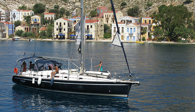 A private sailing boat leaving Kastellorizo harbour, Greece at My Favourite Planet