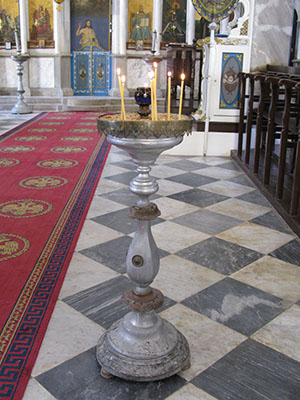 Candles in Agios Giorgos Tou Pigadiou church, Kastellorizo, Greece at My Favourite Planet