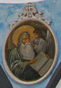 Evangelist writing one of the gospels with the help of an angel, Kastellorizo, Greece at My Favourite Planet