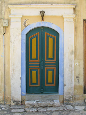 Colourful painted door of a traditional island house in the centre of Kastellorizo, Greece at My Favourite Planet