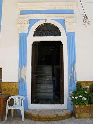 An old doorway with neo-classical features on Kastellorizo island, Greece at My Favourite Planet