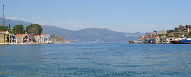 Panoramic of Kastellorizo harbour and the Lycian coast of Turkey beyond at My Favourite Planet