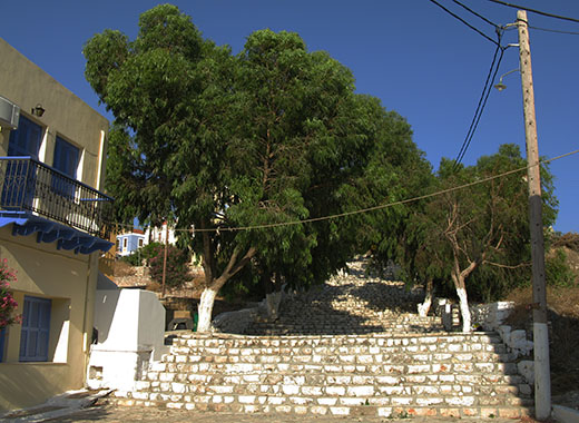 Steps up to the Archaeological Museum and castle from the east side of the main harbour of Kastellorizo, Greece at My Favourite Planet