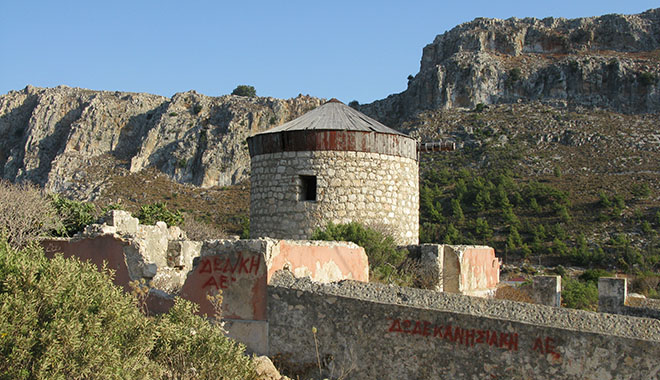 The old windmill and the ruins of the Turkish primary school, Kastellorizo, Greece at My Favourite Planet