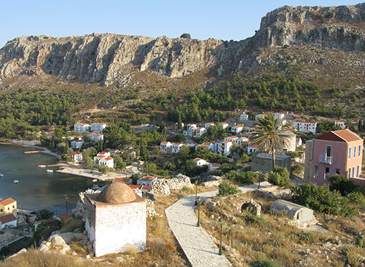 The hamam and Mandraki harbour from the Knights' Castle, Kastellorizo, Greece at My Favourite Planet