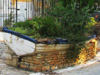 Old wooden boat outside the church of Saint George of the Fields, Horafia district, Kastellorizo, Greece at My Favourite Planet
