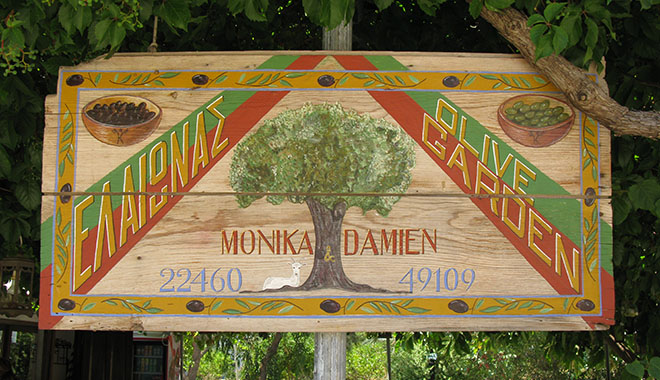 Hand-painted sign for the Olive Garden restaurant in Kastellorizo, Greece at My Favourite Planet