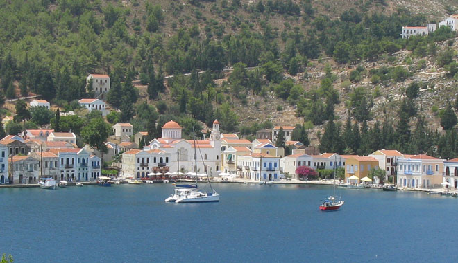 A catamaran and a fishing boat in Kastellorizo harbour, Greece at My Favourite Planet