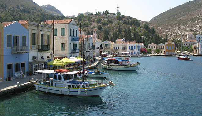 Cruise boats to the Blue Grotto and Ro island in Kastellorizo harbour, Greece at My Favourite Planet