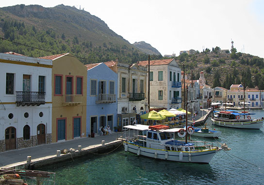 Boats for cruises to the Blue Grotto and Ro island in Kastellorizo harbour, Greece at My Favourite Planet