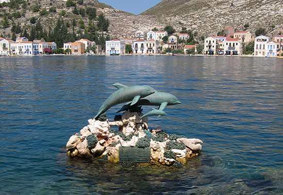 Dolphin sculpture in Kastellorizo harbour, Greece at My Favourite Planet