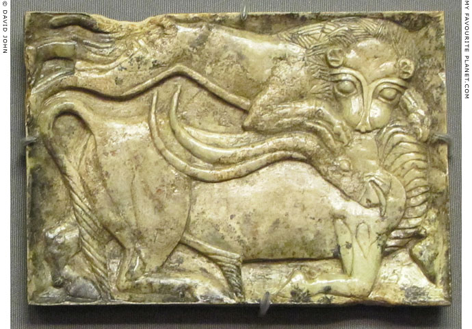An ivory plaque depicting a lion attacking a bull from Spata at My Favourite Planet