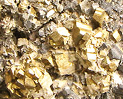 Detail of a piece of mineral ore containing iron pyrites from Olympiada