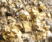 Detail of a piece of mineral ore containing iron pyrites from Olympiadas Detail of a piece of mineral ore containing iron pyrites from Olympiadas