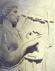 A muse playing a cithara at My Favourite Planet