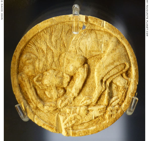 A lion attacking a bull on n ivory pyxis lid from Thebes at My Favourite Planet A lion attacking a bull on n ivory pyxis lid from Thebes at My Favourite Planet