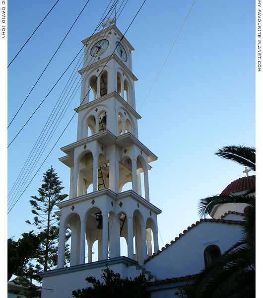 A wedding cake belltower with a clock in Chora village, Samos, Greece at My Favourite Planet
