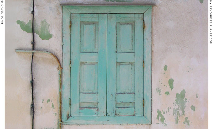 Shuttered window of a house in Kokkari, Samos, Greece at My Favourite Planet