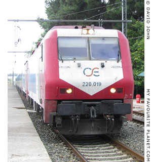 An OSE Athens-Thessaloniki train arrives in Livadia, Central Greece at My Favourite Planet An OSE Athens-Thessaloniki train arrives in Livadia, Central Greece at My Favourite Planet