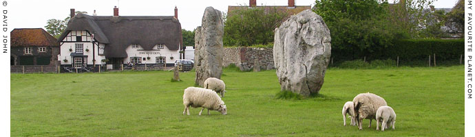 Megaliths of Avebury Henge, with The Red Lion pub in background