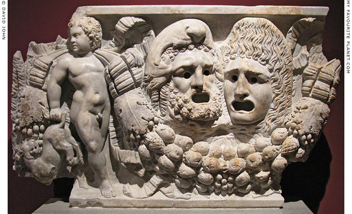 Marble relief of Herakles and a woman as tragic masks at My Favourite Planet