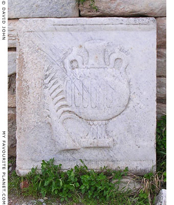 Marble relief of a palm branch and oil jar, Ephesus, Turkey at My Favourite Planet