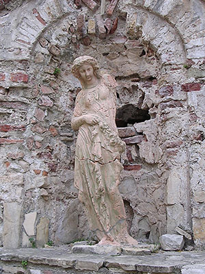 Statue of a young woman in the entrance to the Genoese fortress on Guvercin Ada (Pigeon Island), Kusadasi, Turkey at My Favourite Planet