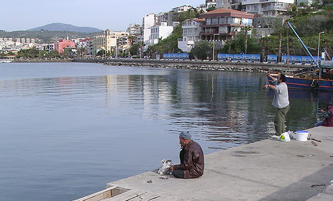 Local anglers on the causeway to Guvercin Ada (Pigeon Island), Kusadasi, Turkey at My Favourite Planet