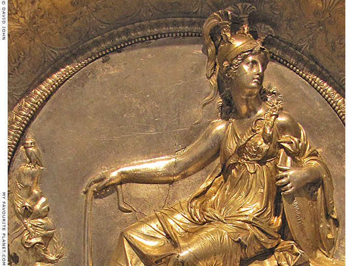 A golden relief of Athena and her owl at My Favourite Planet A golden relief of Athena and her owl at My Favourite Planet