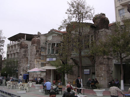 Storks' nests, cafés and dilapidated houses on a pedestrianized street in Selcuk, Turkey at My Favourite Planet