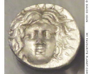 The head of Helios with a crown of solar rays on a silver tetradrachm of Rhodes at My Favourite Planet